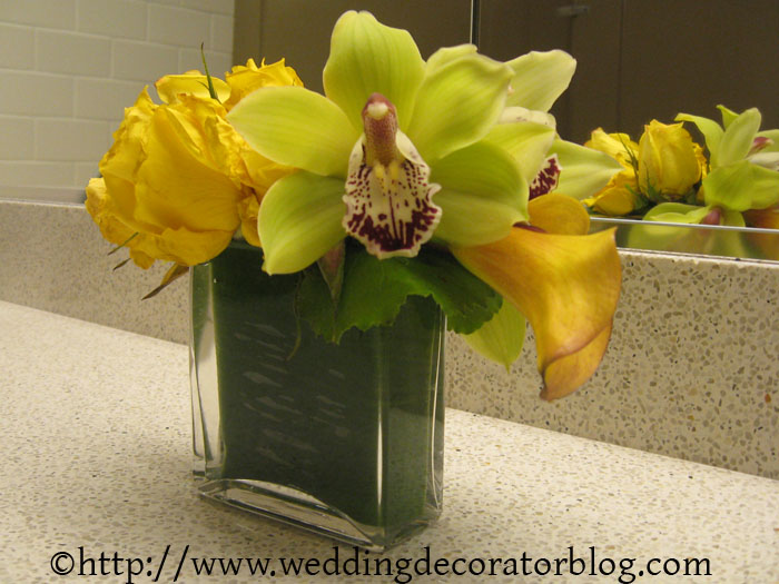 Small, yellow and green flower arrangements